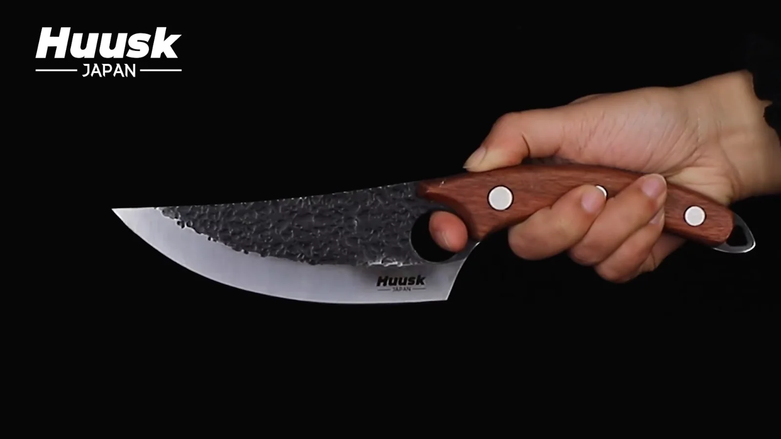 The blade out of the block: hammered flat, full tang, and the finger hole that most of the hand forged line carries.